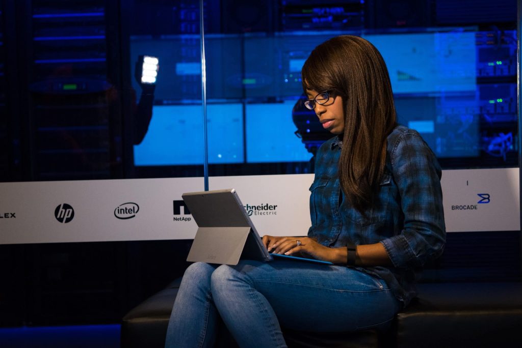 a digital apprentice working on her laptop.