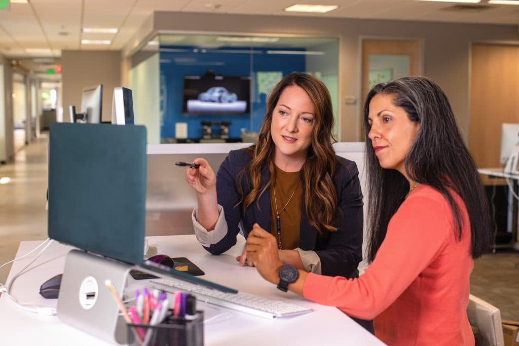 Two female workers in the business services industry